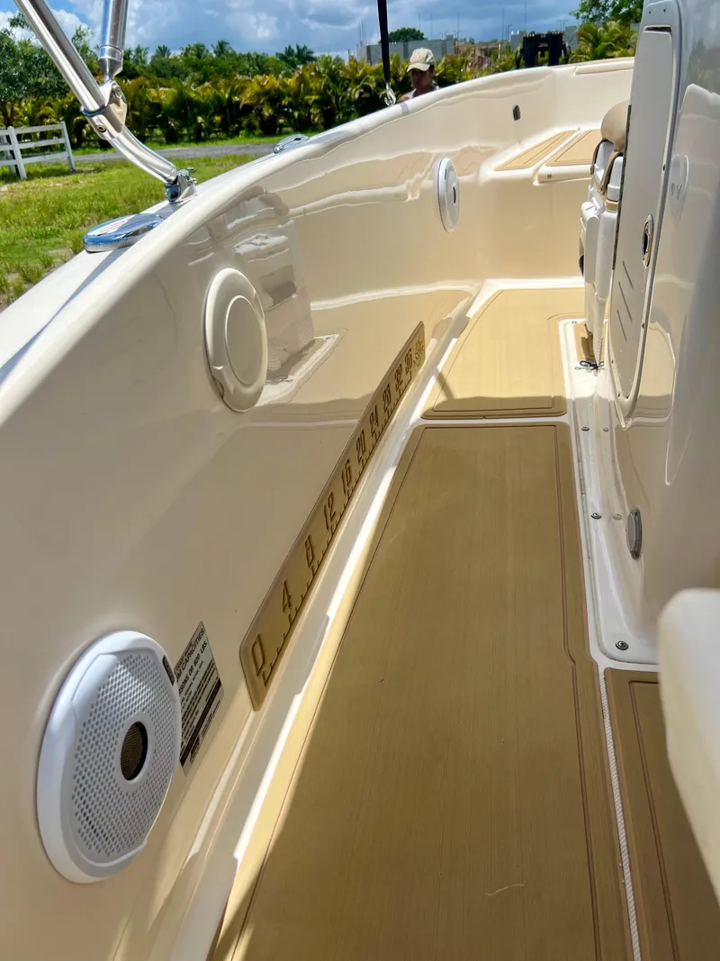 Slide: The Image of 2019 Scout Sportfish 175 boat interior with speakers and measuring ruler. - 19