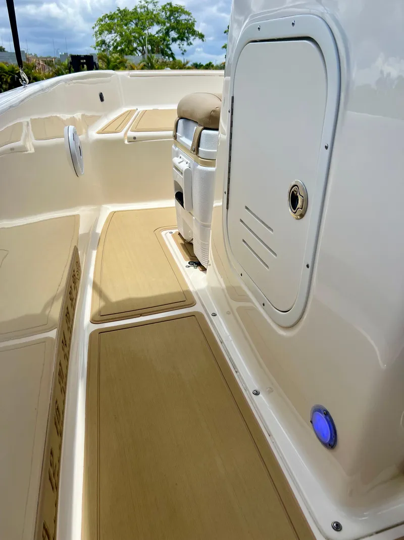 Slide: The Image of 2019 Scout Sportfish 175 boat interior with storage compartment and seating. - 20