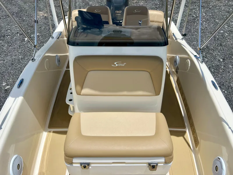 Slide: The Image of 2019 Scout Sportfish 175 boat interior with beige seating and console. - 25