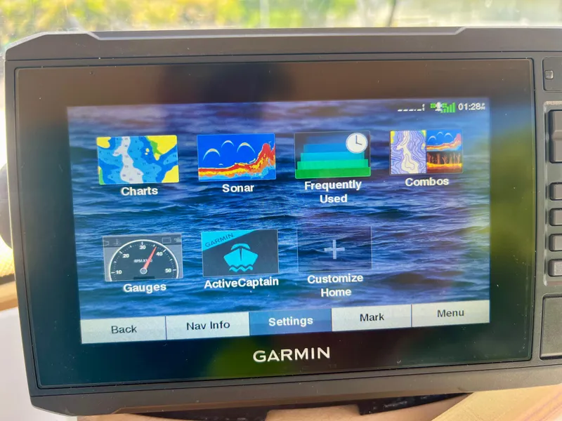Slide: The Image of Garmin marine GPS display on a 2019 Scout Sportfish 175 boat showing various navigation options. - 29