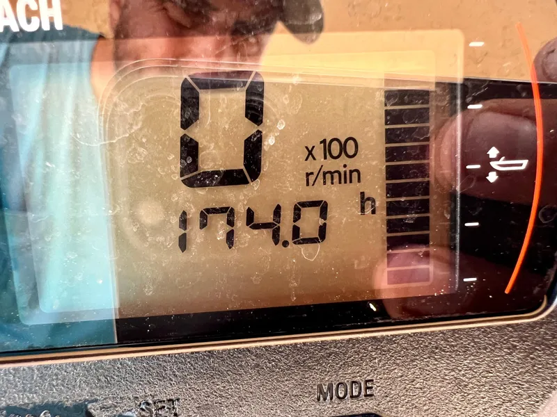 Slide: The Image of Close-up of 2019 Scout Sportfish 175 engine hour meter displaying 174.0 hours. - 30