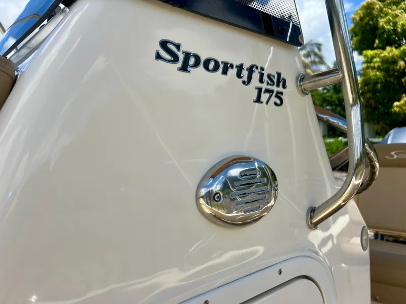 Slide: The Image of 2019 Scout Sportfish 175 boat close-up with logo and details. - 32