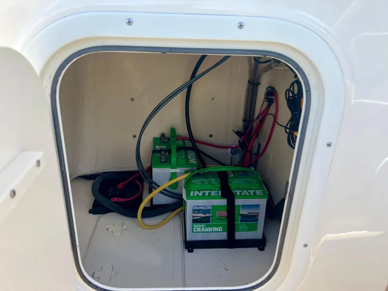 Slide: The Image of Battery compartment of a 2019 Scout Sportfish 175 boat with Interstate marine batteries. - 35