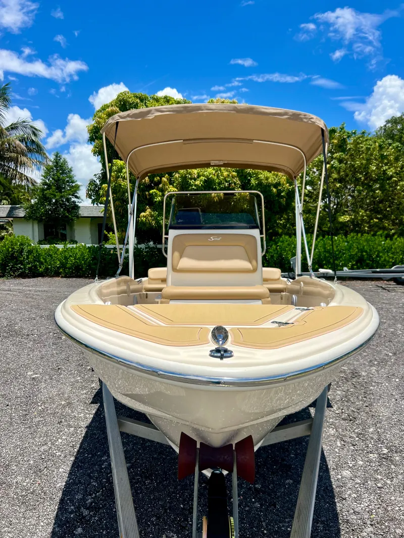 Slide: The Image of 2019 Scout Sportfish 175 boat with canopy on a sunny day. - 8