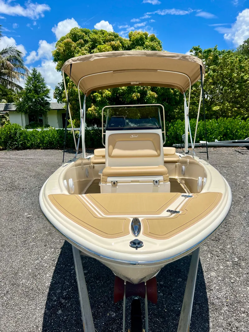 Slide: The Image of 2019 Scout Sportfish 175 boat with canopy on a sunny day. - 9