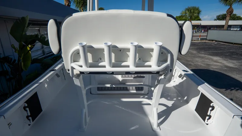 Slide: The Image of 2025 Tidewater 2210 Carolina Bay boat interior with rod holders and seating. - 12