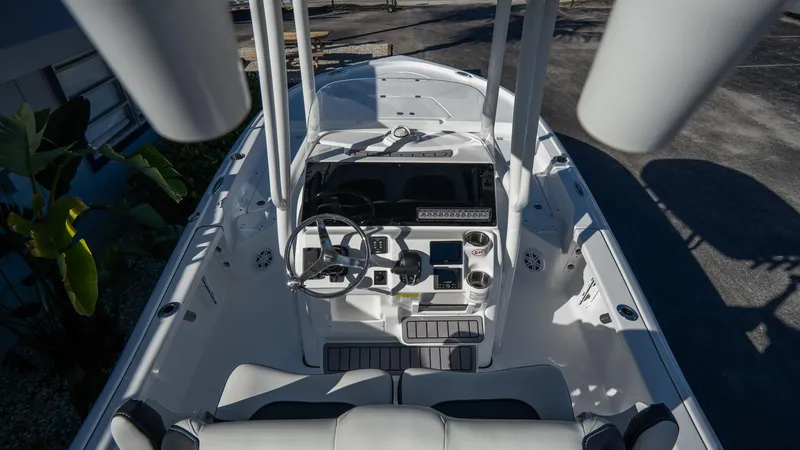 Slide: The Image of 2025 Tidewater 2210 Carolina Bay boat interior, steering console and seating. - 13