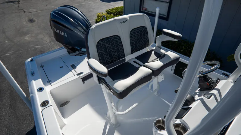 Slide: The Image of 2025 Tidewater 2210 Carolina Bay boat with Yamaha engine and dual captain's chairs. - 16