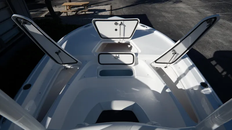 Slide: The Image of 2025 Tidewater 2210 Carolina Bay boat with open storage compartments. - 20