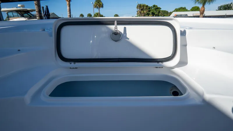 Slide: The Image of Open storage compartment on a 2025 Tidewater 2210 Carolina Bay boat. - 23
