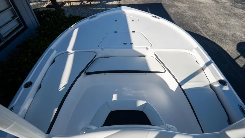 Slide: The Image of 2025 Tidewater 2210 Carolina Bay boat deck with seating and storage compartments. - 24