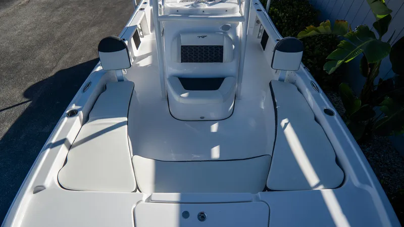 Slide: The Image of 2025 Tidewater 2210 Carolina Bay boat interior with seating and console. - 26