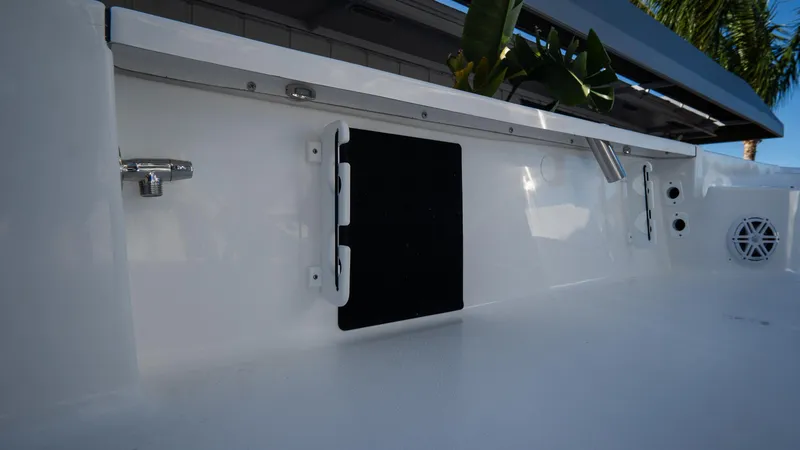 Slide: The Image of 2025 Tidewater 2210 Carolina Bay boat interior detail with storage compartment. - 30