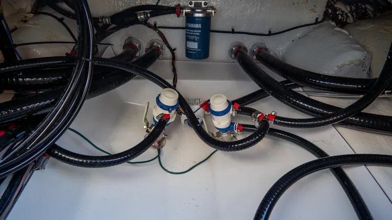 Slide: The Image of Bilge area of 2025 Tidewater 2210 Carolina Bay boat with hoses and filters. - 9