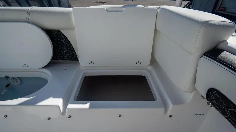 Slide: The Image of Open storage compartment on a 2025 Tidewater 220 LXF boat. - 10