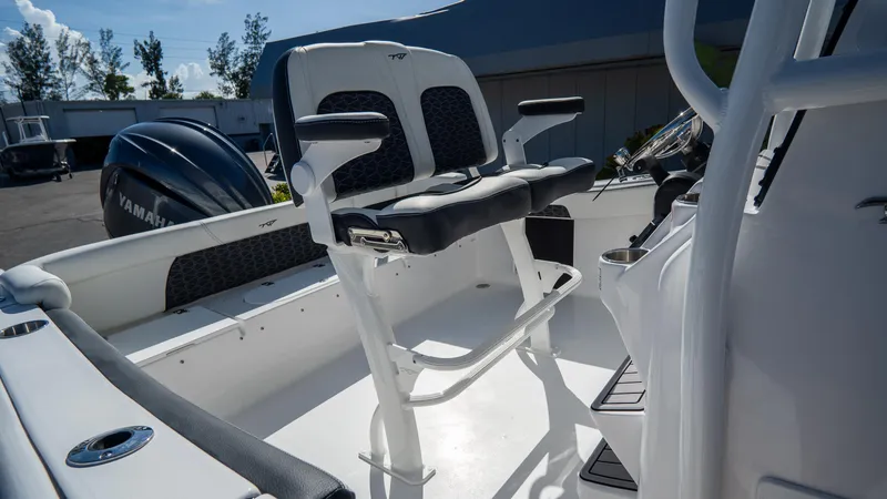 Slide: The Image of 2025 Tidewater 220 LXF boat interior with dual seating and Yamaha engine. - 15
