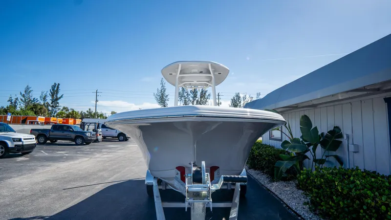 Slide: The Image of 2025 Tidewater 220 LXF boat on trailer in outdoor setting. - 2