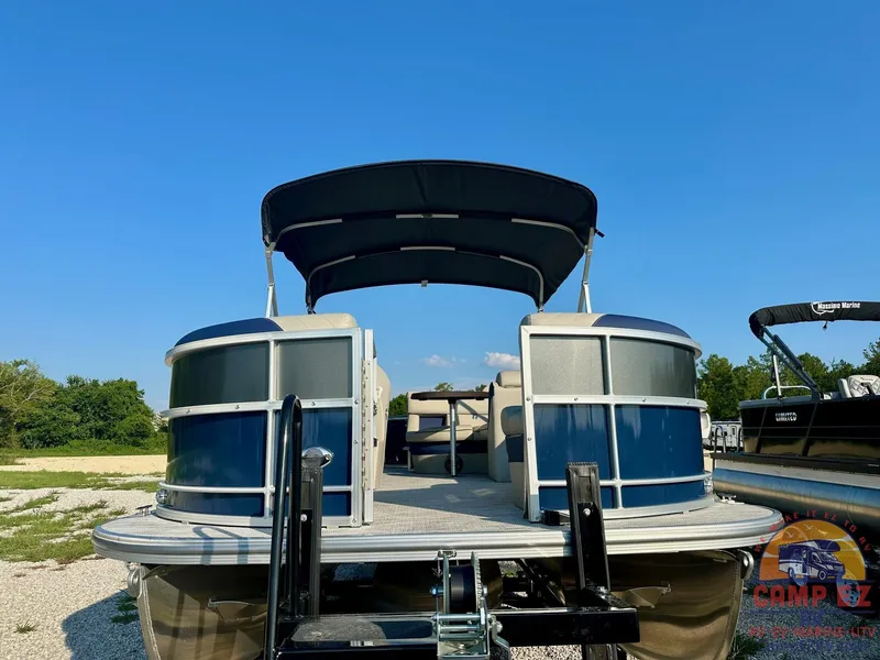 Slide: The Image of 2025 South Bay 224FCR LE pontoon boat with canopy on trailer. - 1