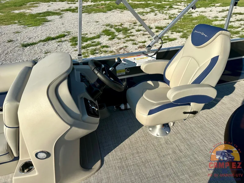 Slide: The Image of 2025 South Bay 224FCR LE boat interior with captain's chair and steering console. - 12