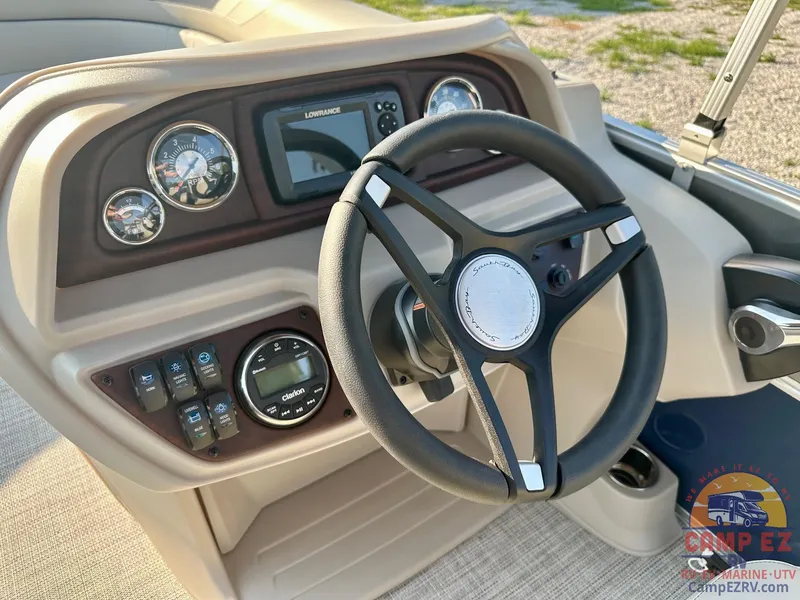 Slide: The Image of 2025 South Bay 224FCR LE boat dashboard with steering wheel and control panel. - 13