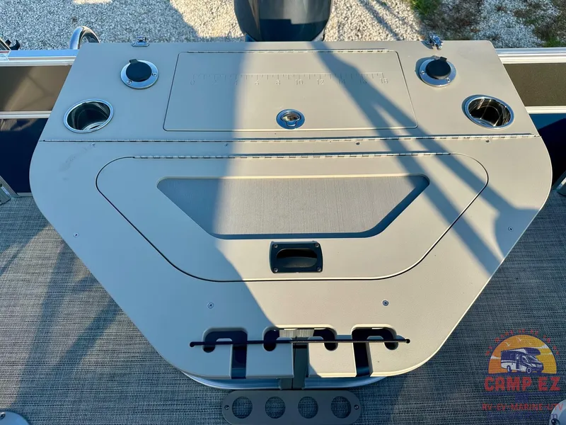 Slide: The Image of 2025 South Bay 224FCR LE boat console with cup holders and storage compartments. - 19