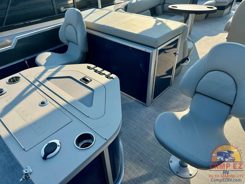 Slide: The Image of Interior of 2025 South Bay 224FCR LE pontoon boat with seating and table. - 21