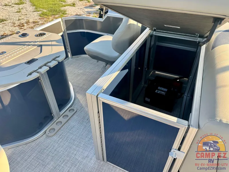Slide: The Image of 2025 South Bay 224FCR LE pontoon boat interior with storage compartments. - 24