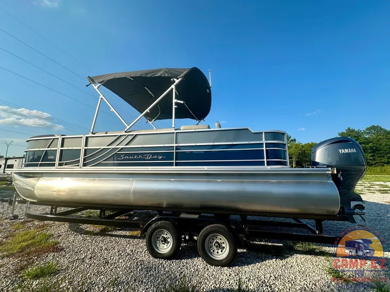 Slide: The Image of 2025 South Bay 224FCR LE pontoon boat with Yamaha engine on trailer. - 3