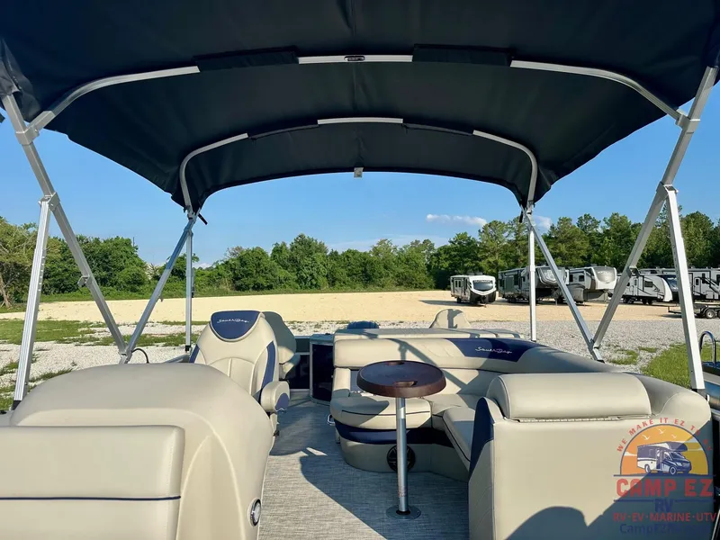 Slide: The Image of 2025 South Bay 224FCR LE pontoon boat interior with canopy and seating. - 9