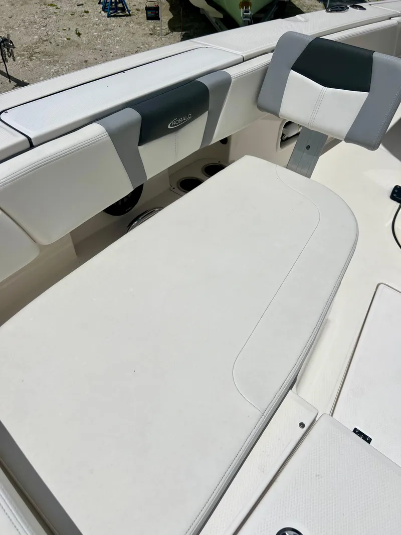 Slide: The Image of 2022 Robalo 266 Cayman boat interior seating and storage area. - 25