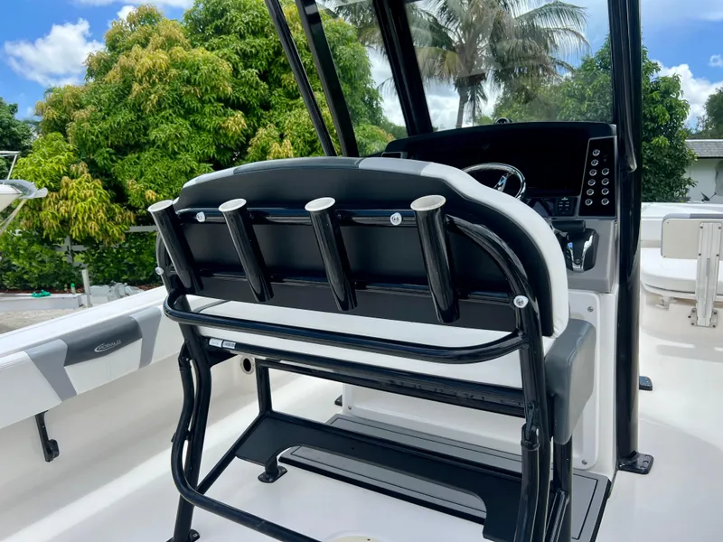 Slide: The Image of 2022 Robalo 266 Cayman boat cockpit with seating and control panel. - 26