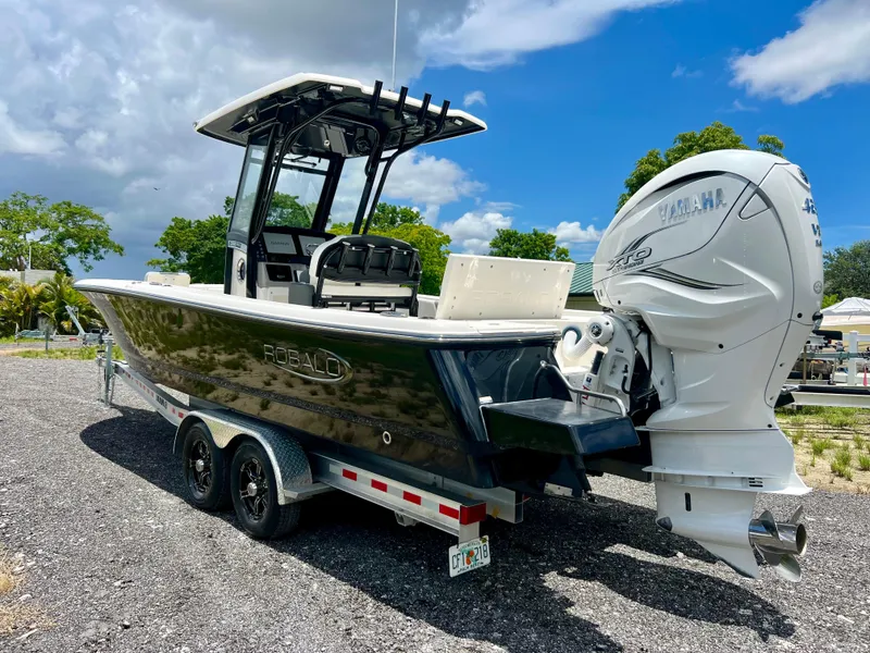 Slide: The Image of 2022 Robalo 266 Cayman boat on a trailer with Yamaha outboard motor. - 43