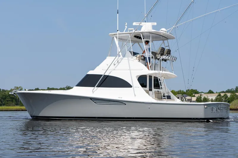 Slide: The Image of 2022 Viking 46 Billfish yacht on calm water, side view. - 16