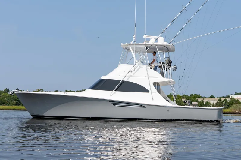 Slide: The Image of 2022 Viking 46 Billfish yacht cruising on calm water. - 17