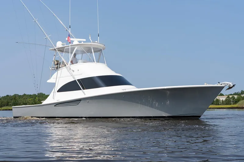 Slide: The Image of 2022 Viking 46 Billfish yacht on calm water, side view. - 2