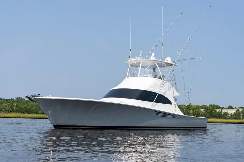 Slide: The Image of 2022 Viking 46 Billfish yacht on calm water, clear sky background. - 21
