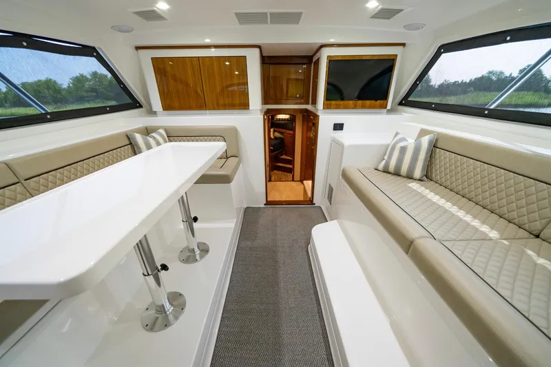 Slide: The Image of Luxurious interior of 2022 Viking 46 Billfish yacht with elegant seating and table. - 32