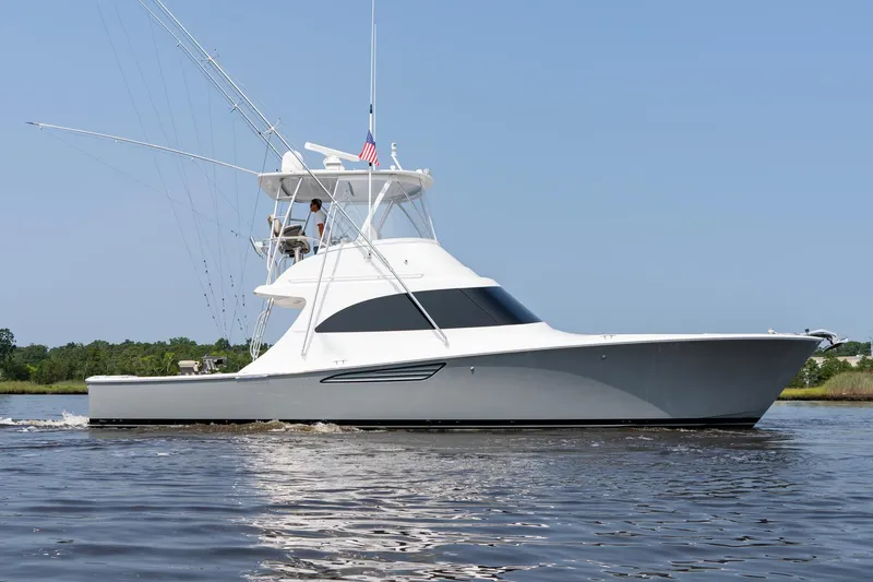 Slide: The Image of 2022 Viking 46 Billfish yacht cruising on calm waters. - 4