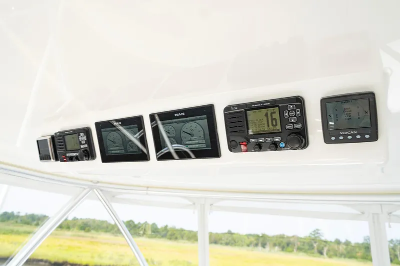 Slide: The Image of Control panel of 2022 Viking 46 Billfish boat with multiple electronic displays. - 42