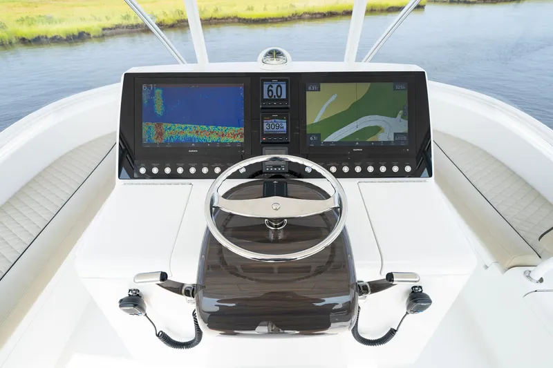 Slide: The Image of Viking 46 Billfish 2022 helm with advanced navigation displays and steering wheel. - 43