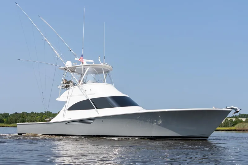 The Image of 2022 Viking 46 Billfish yacht on calm water under clear sky. - 0