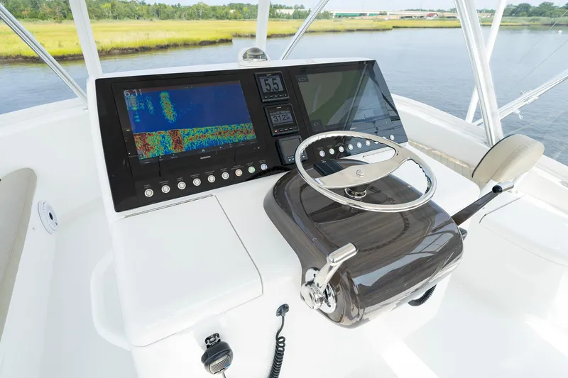 Slide: The Image of 2022 Viking 46 Billfish helm with advanced navigation display and steering wheel. - 44