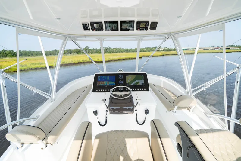 Slide: The Image of 2022 Viking 46 Billfish helm with modern controls and panoramic water view. - 45
