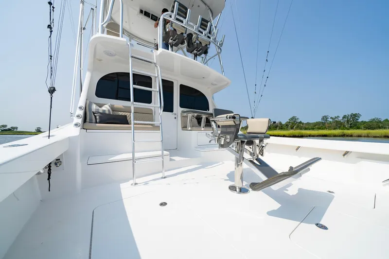 Slide: The Image of 2022 Viking 46 Billfish yacht deck with fishing chair and ladder. - 48