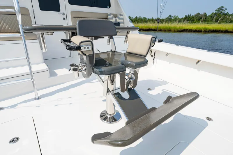 Slide: The Image of 2022 Viking 46 Billfish cockpit with fishing chair and rod holders. - 49