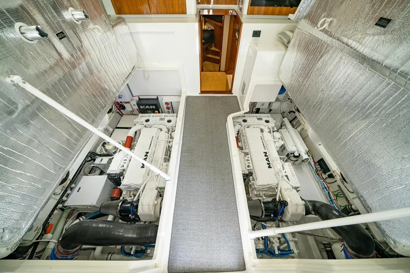 Slide: The Image of Engine room of 2022 Viking 46 Billfish with dual engines and insulated walls. - 5