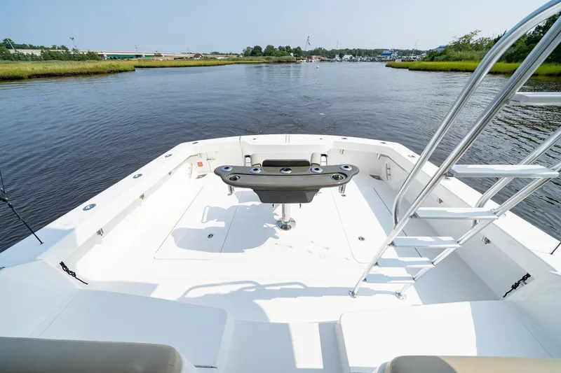 Slide: The Image of 2022 Viking 46 Billfish boat deck with fishing setup on calm water. - 22