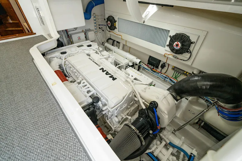 Slide: The Image of Engine room of 2022 Viking 46 Billfish with MAN engine, showcasing clean design and components. - 6