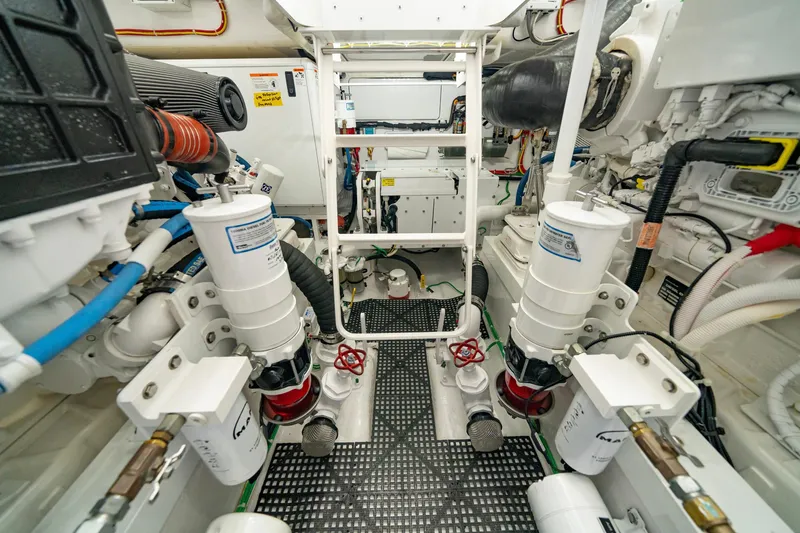 Slide: The Image of Engine room of 2022 Viking 46 Billfish, showcasing advanced marine machinery and components. - 8
