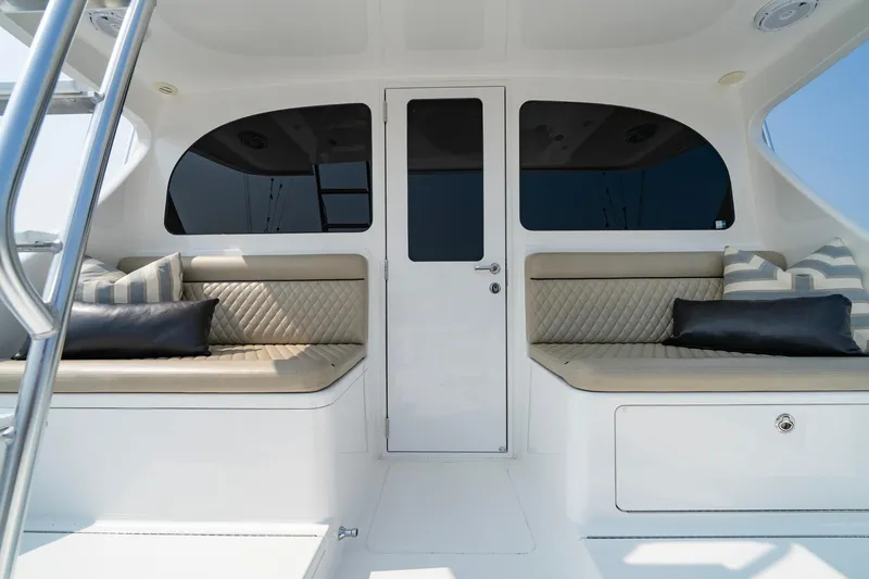 Slide: The Image of The image shows the cockpit of a 2022 Viking 46 Billfish with cushioned seating. - 50